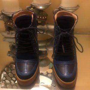 Leather platform wedged sneaker.